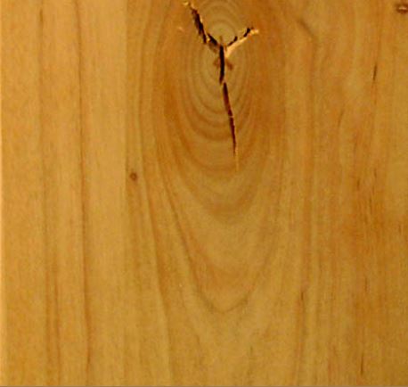 This is an image of garage door wood grain composed of alder knotty wood.