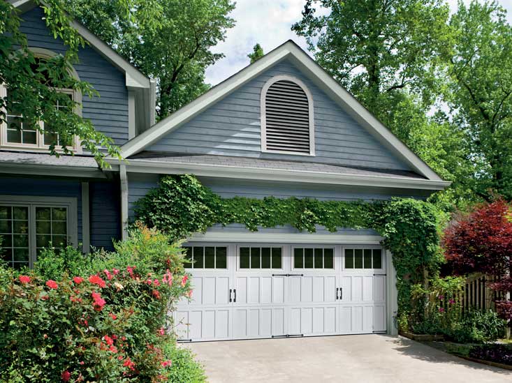 This is an image of an Amarr Classica white steel garage door.