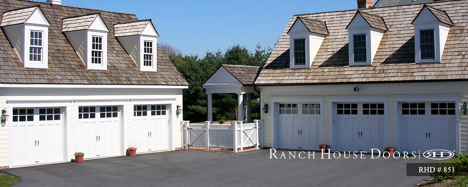This is an image of a Cape Cod style garage door with windows.