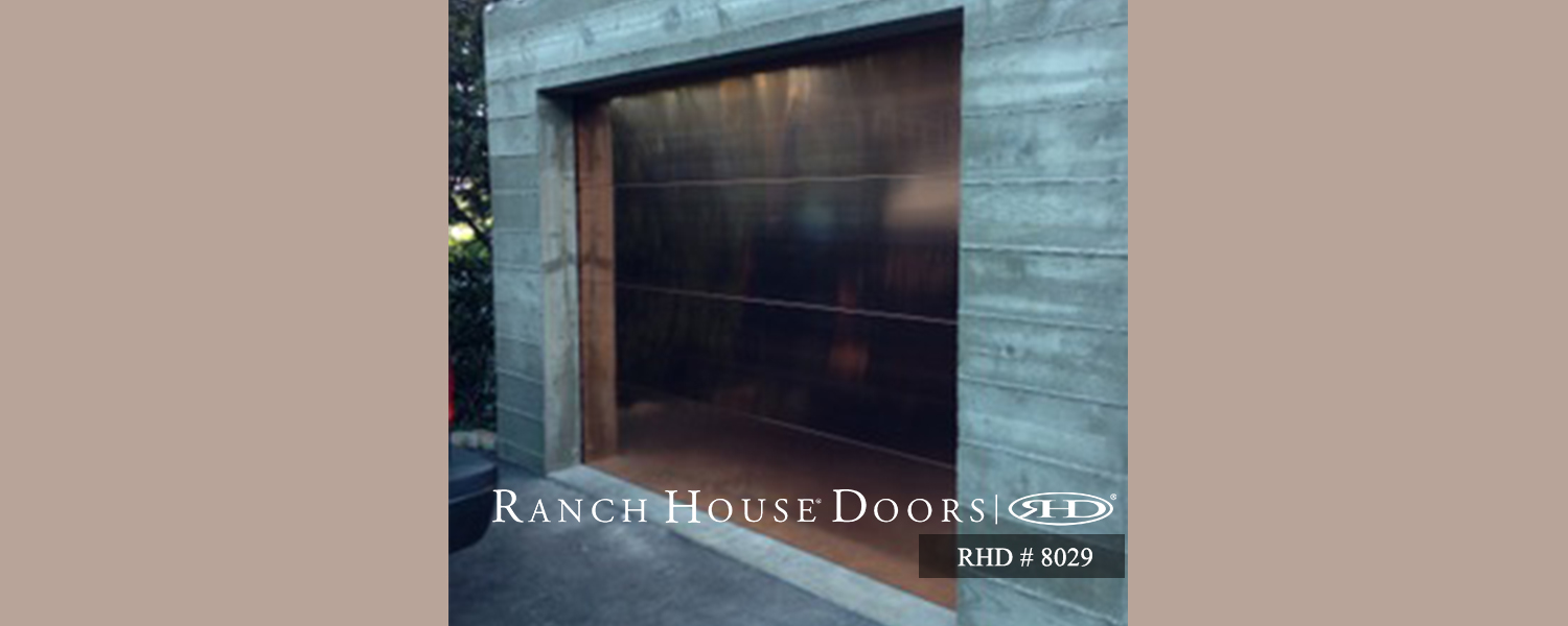 This is an image of a modern contemporary bronze garage door in Laguna Beach, CA.