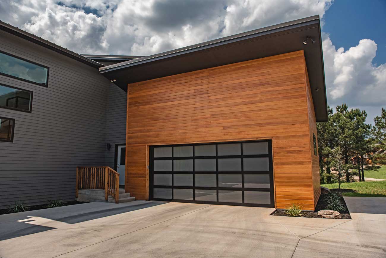 This is an image of an aluminum garage door with black edges on a modern garage door.