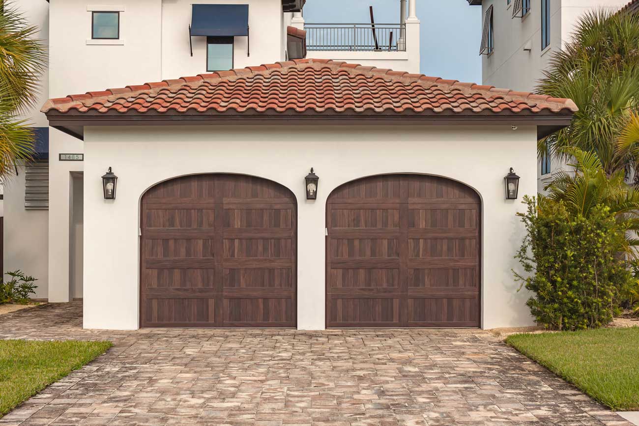 This is an image of a stamped carriage style faux wood door on a Spanish style Orange County home