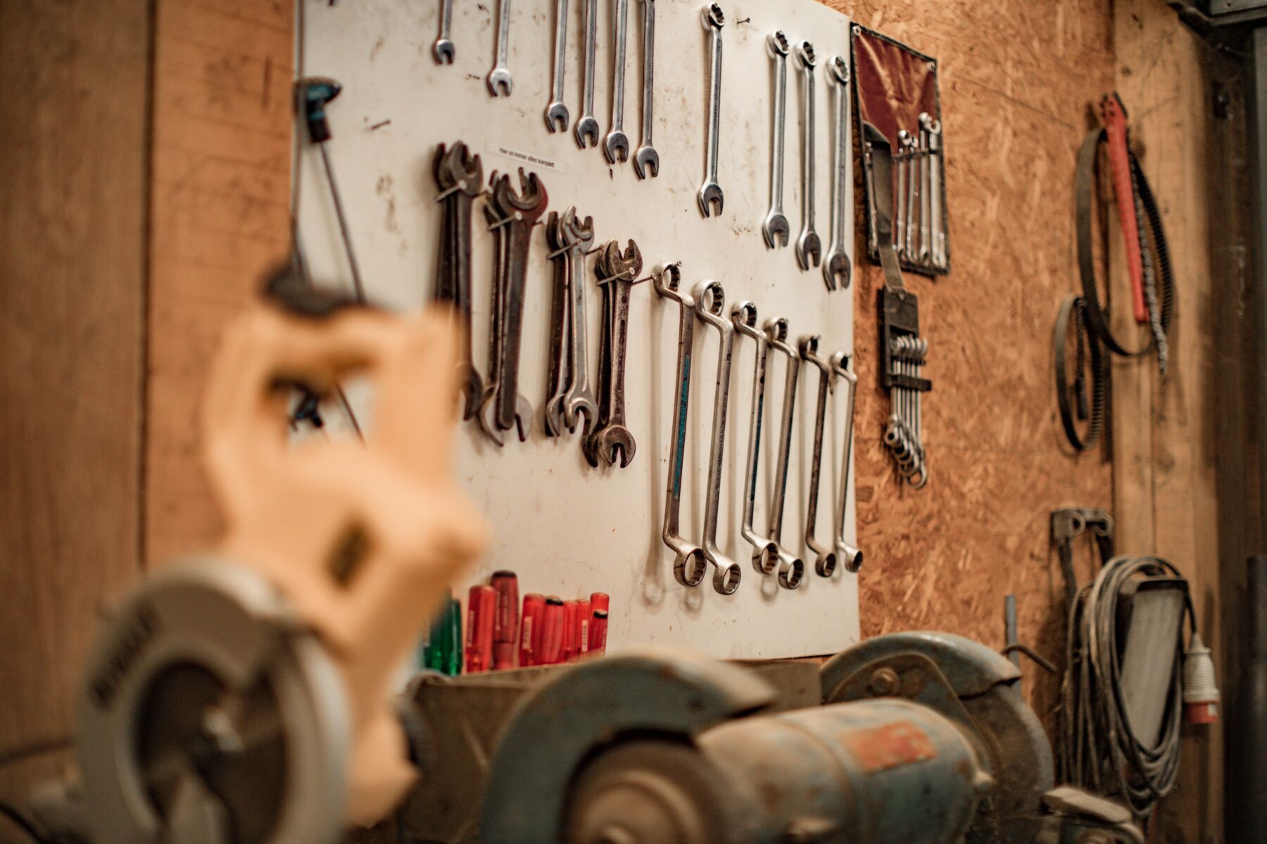 This is an image of a variety of handtools used for maintenance and repair of garage doors and gates.