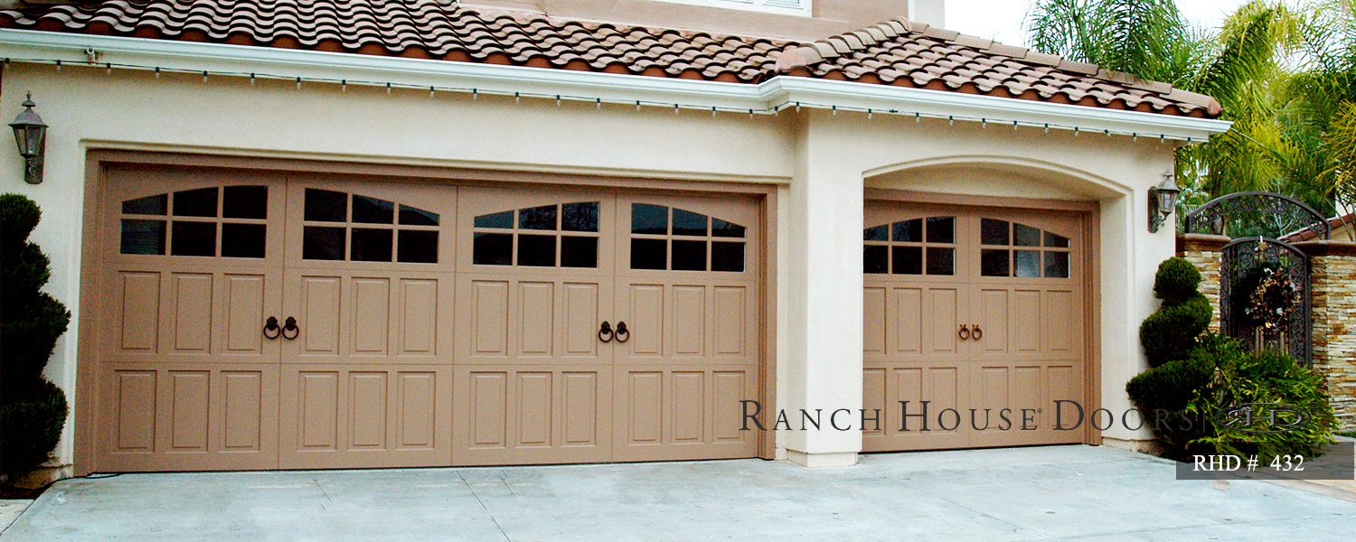 This is an image of a spanish style wood garage door with light wood in Laguna Woods, CA.