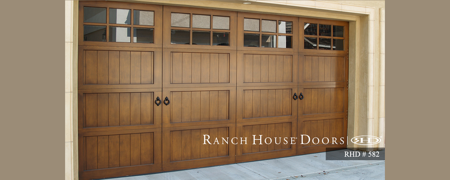 This is an image of a spanish style wood garage door with windows in Tustin, CA.