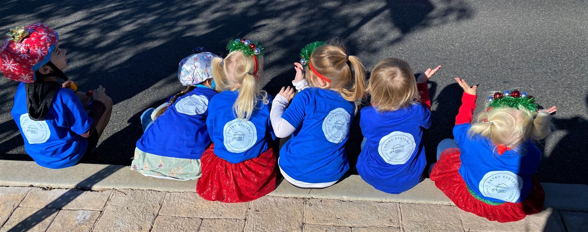 This is an image of the children of Entry Systems staff at the Laguna Niguel holiday parade in 2021