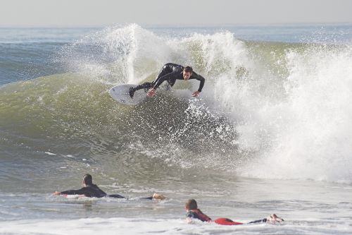 This is an image of a man surfing an ocean wave in Newport Beach, CA.