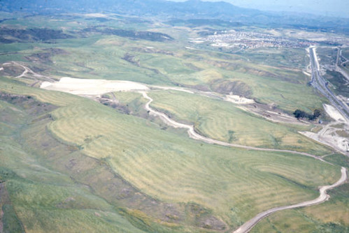 This is an image from the Orange County archives of Mission Viejo, California in 1968. It shows grassy fields where Crown Valley Parkway came to be and no freeway in sight.